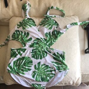 Beautiful green leaves on white back ground. Baithing suit.